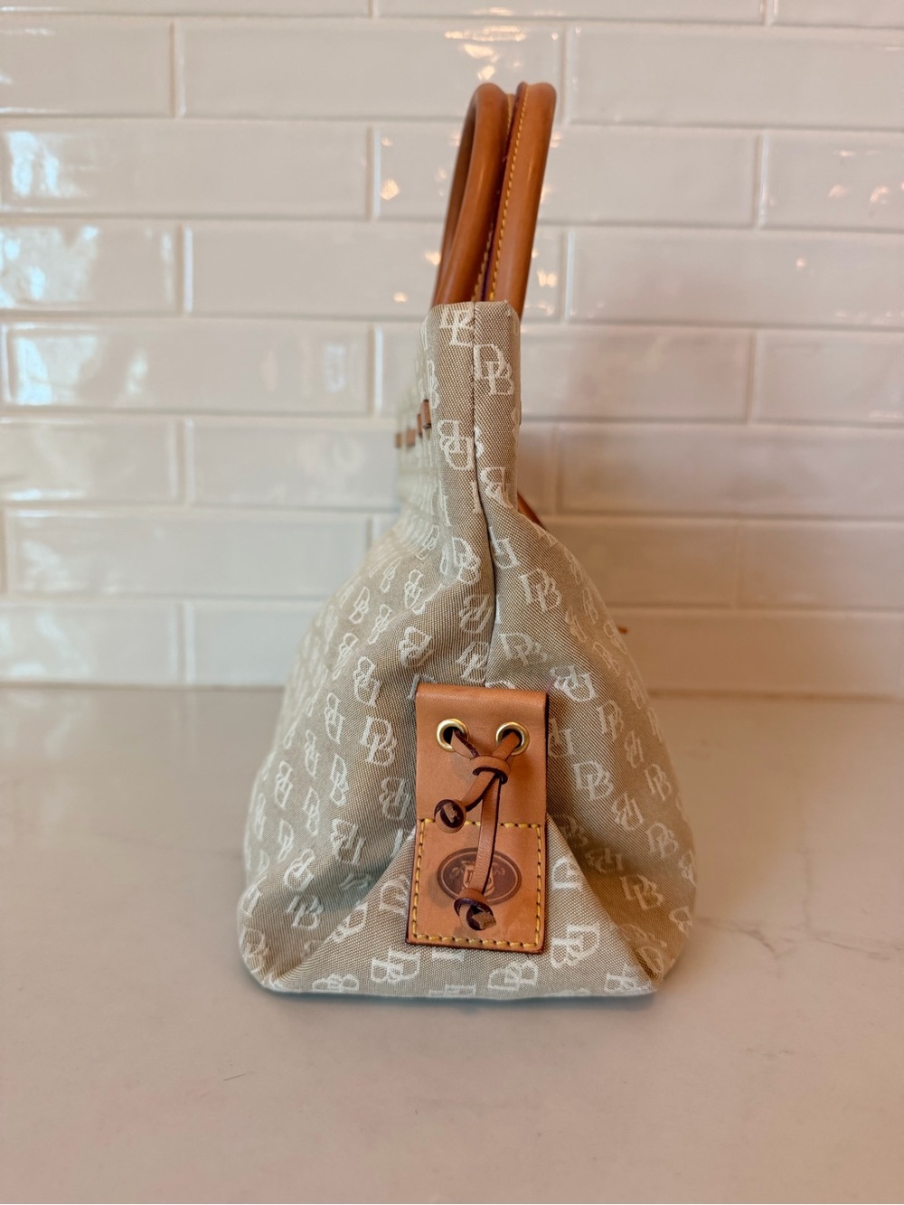 Dooney & Bourke tassel tote with brown leather handles - Picture 3 of 12